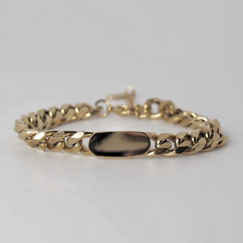 Armbånd med bred gullenke med flat detalj