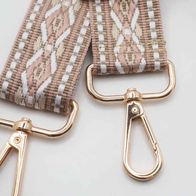 Veskestropp med geometrisk mønster beige krem