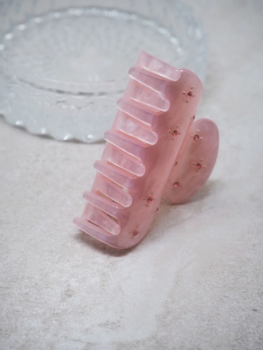 Hårklype med små perleblomster lyserosa