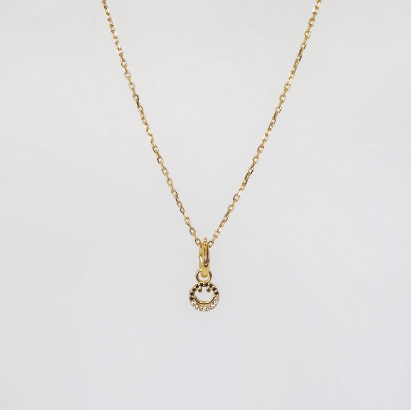 Charm smile blank/svart
