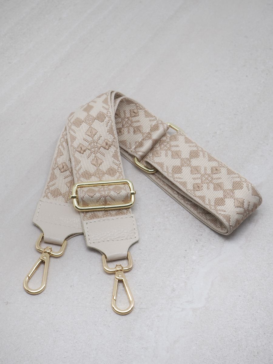 Veskestropp skinndetaljer lyse taupe og hvit 