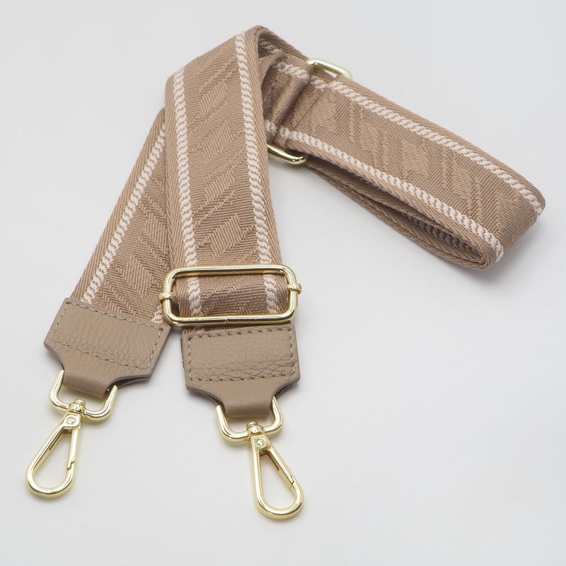 Veskestropp med houndstooth mønster med skinndetaljer lysetaupe