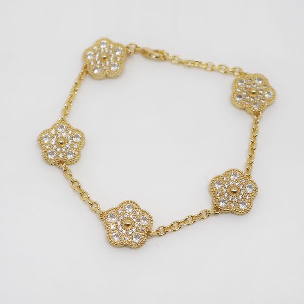 Hovedbilde Gullfarget armbånd med blomster zirkoner